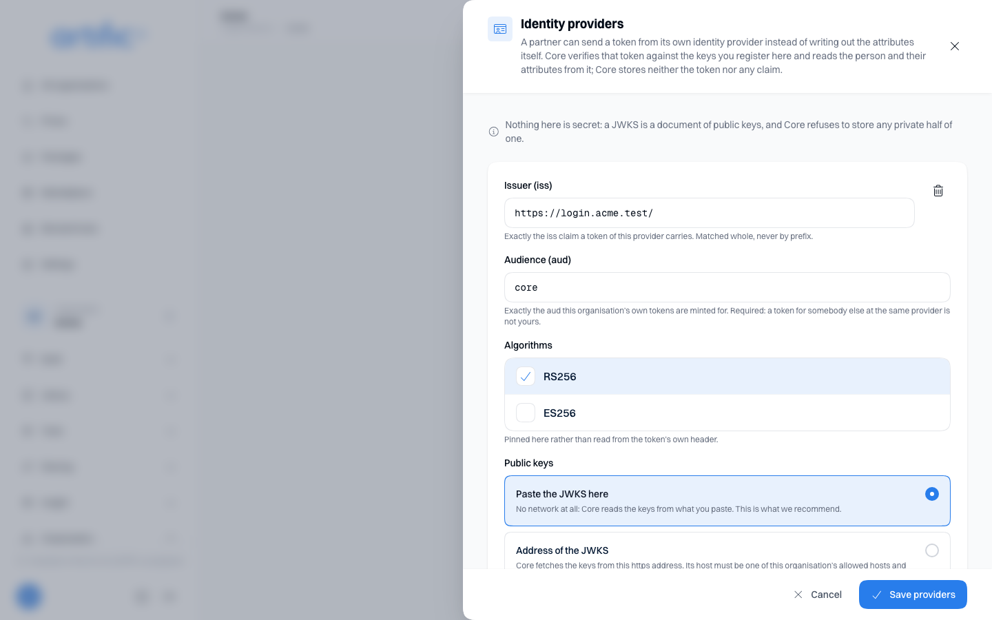The Identity providers card on Settings, under the Label vocabulary card: its explanation, a note that nothing here is secret, and one provider with the issuer https://login.acme.test/ and the audience core.